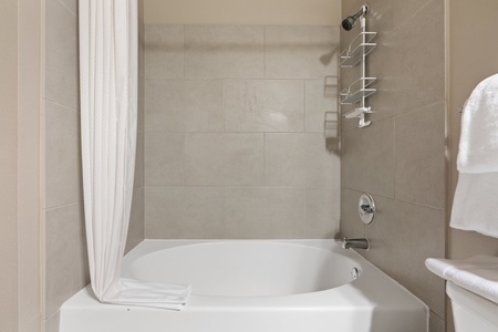 Begin anew in the contemporary walk-in shower with updated fixtures.