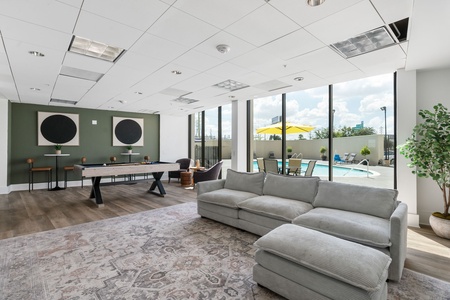 The residents' lounge provides a space to relax and connect, with a pool table and TV