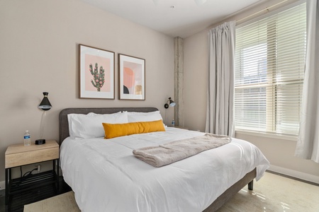 Unwind in style on a memory foam bed in this cozy bedroom.