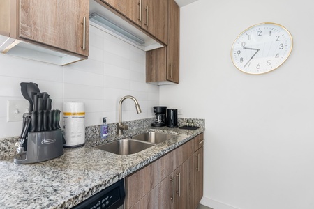 Craft tasty dishes in this contemporary kitchen with all the necessary amenities.