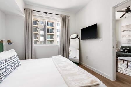 Relax into dreamland on a memory foam mattress in this snug bedroom equipped with a smart TV.