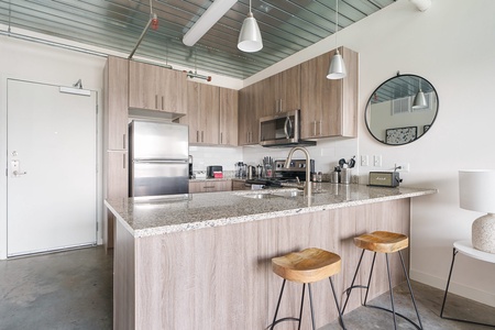 Whip up culinary delights in this modern kitchen with all the essentials.