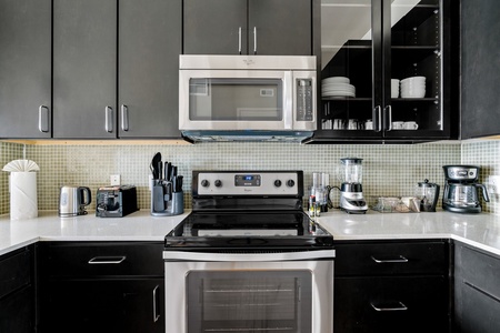 Prepare your favorite dishes in this well-equipped kitchen with modern amenities.