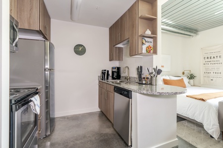 Whip up tasty dishes in this contemporary, fully-equipped kitchen.