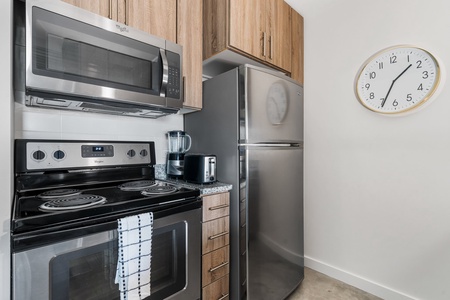 Whip up culinary delights in this modern kitchen with all the essentials.