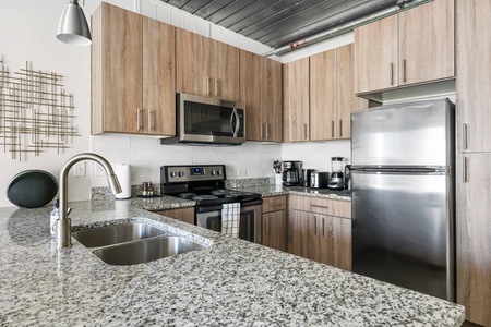 Prepare your favorite dishes in this well-equipped kitchen with modern amenities.