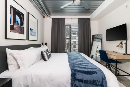 Rest in style on a memory foam bed in this cozy bedroom.
