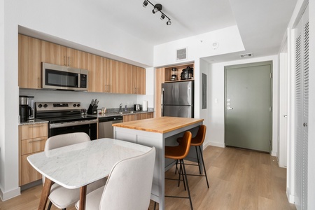 Experience the best of both worlds in this cozy living space with an adjacent dining area.