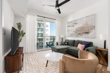 Snuggle in and enjoy the smart TV experience in this chic and comfortable modern living area.