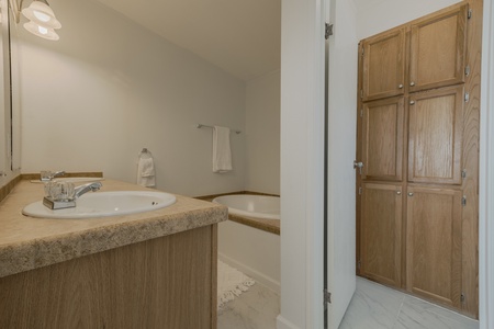 One of the en-suite bathrooms with a bath and shower