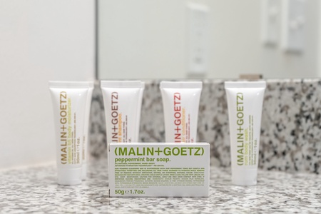 Spoil yourself with complimentary toiletries by Malin + Goetz in the bathroom.