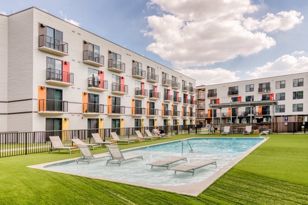 The apartment community features a swimming pool, one acre courtyard, and shared BBQ grills