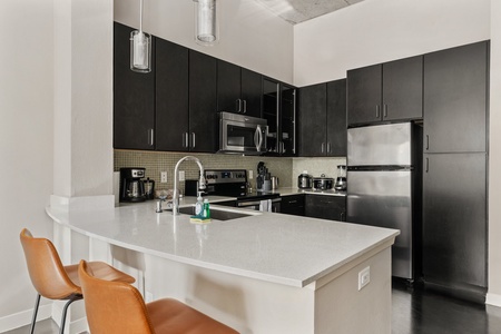 Enjoy cooking in this contemporary kitchen with all the essentials.