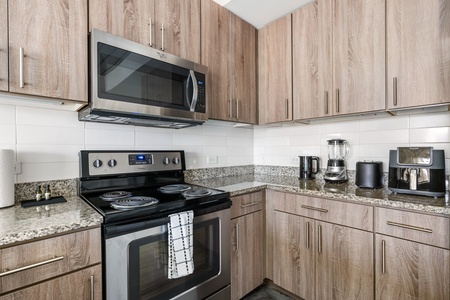 Craft tasty dishes in this contemporary kitchen with all the necessary amenities.