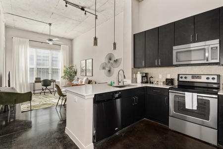 Whip up culinary delights in this modern kitchen with all the essentials.