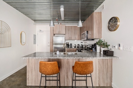 Craft tasty dishes in this contemporary kitchen with all the necessary amenities.