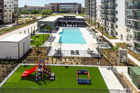The community features a pool with communal grills and a kids' play area