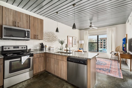 Whip up culinary delights in this modern kitchen with all the essentials.