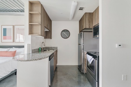 Prepare delicious meals in this modern kitchen with all the essentials.