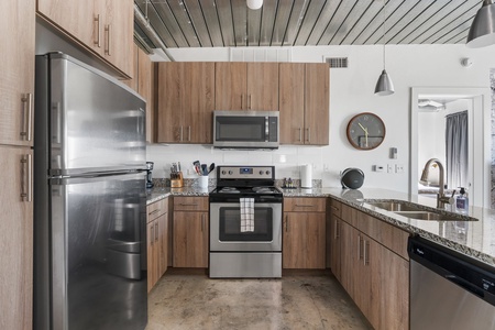 Whip up culinary delights in this modern kitchen with all the essentials.