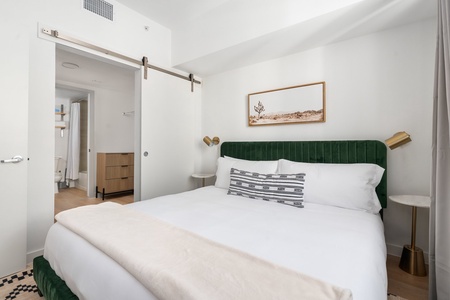 Relax in luxury on a memory foam mattress within this welcoming bedroom featuring a smart TV.