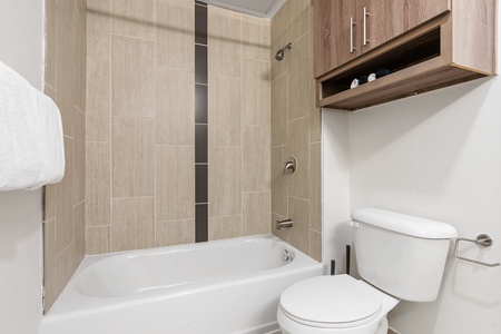 Renew in the updated walk-in shower with modern fixtures.