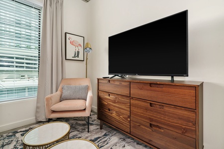 Get comfortable and enjoy your favorite shows in the inviting living room with a smart TV.