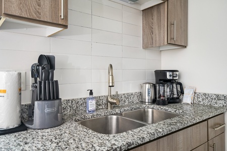 Craft tasty dishes in this contemporary kitchen with all the necessary amenities.