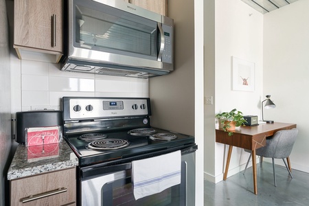 Whip up tasty treats in this modern kitchen with all the essentials.