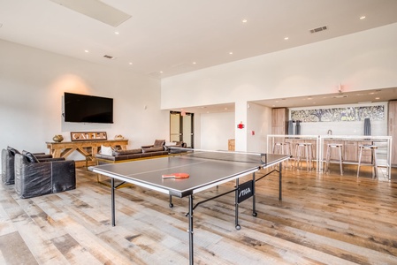 The residents' lounge includes a pool table, darts board, table tennis, and classic arcade games