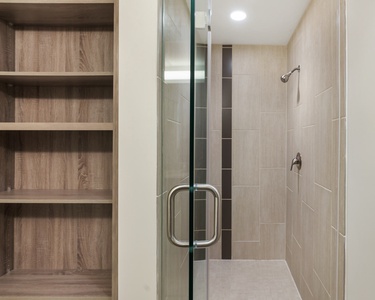 Begin anew in the contemporary walk-in shower with updated fixtures.