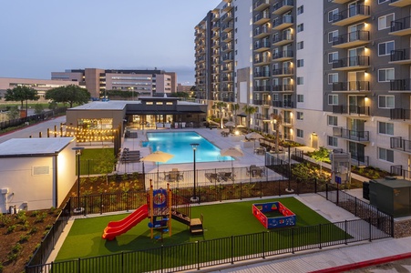 The community features a pool with communal grills and a kids' play area