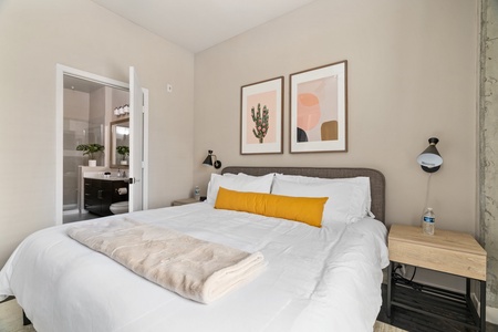 Discover tranquility on a memory foam bed in this inviting bedroom.