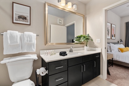 Revitalize in the sleek bathroom with complimentary toiletries.