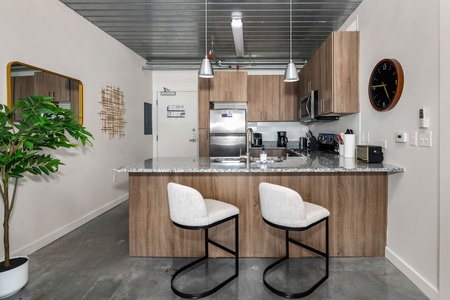 Craft tasty dishes in this contemporary kitchen with all the necessary amenities.