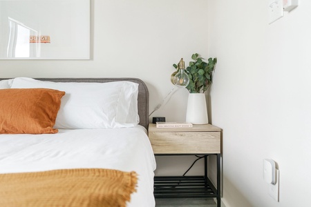 Unwind in style on a memory foam bed in this cozy bedroom.