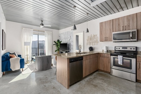 Whip up culinary delights in this modern kitchen with all the essentials.