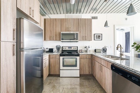 Whip up culinary delights in this modern kitchen with all the essentials.