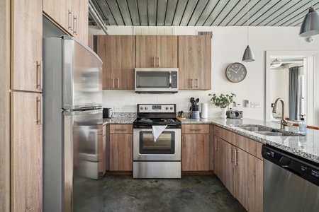 Whip up culinary delights in this modern kitchen with all the essentials.