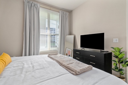 Sink into comfort on a memory foam bed in this inviting bedroom.