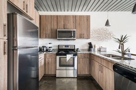 Craft tasty dishes in this contemporary kitchen with all the necessary amenities.