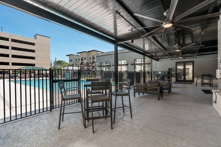 The community features a pool with communal grills and a kids' play area