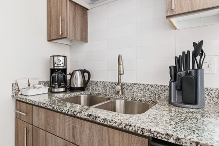 Prepare your favorite dishes in this well-equipped kitchen with modern amenities.