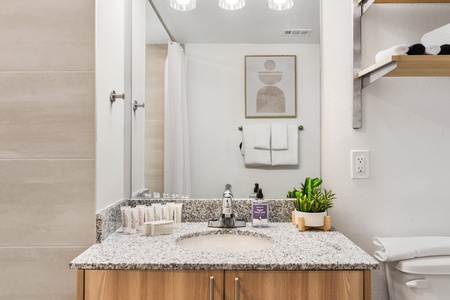 Luxuriate in complimentary toiletries by Malin + Goetz in the bathroom.