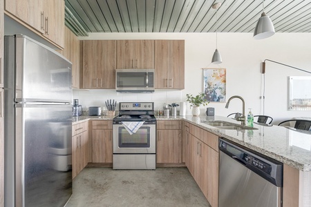 Whip up tasty treats in this modern kitchen with all the essentials.