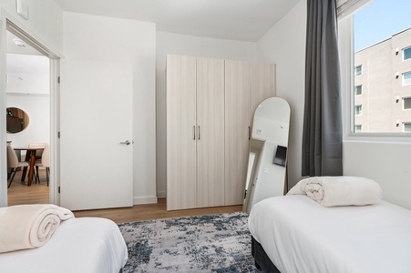 Enjoy a comfortable stay in our bedroom with two inviting twin beds.