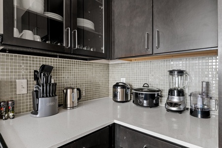 Prepare your favorite dishes in this well-equipped kitchen with modern amenities.