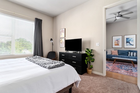 Relax into dreamland on a memory foam mattress in this snug bedroom equipped with a smart TV.