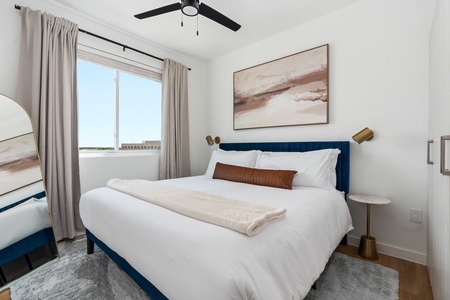 Bedroom 2: Relax in luxury on a memory foam mattress within this welcoming bedroom featuring a smart TV.