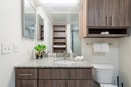 Revitalize in the sleek bathroom with complimentary toiletries.